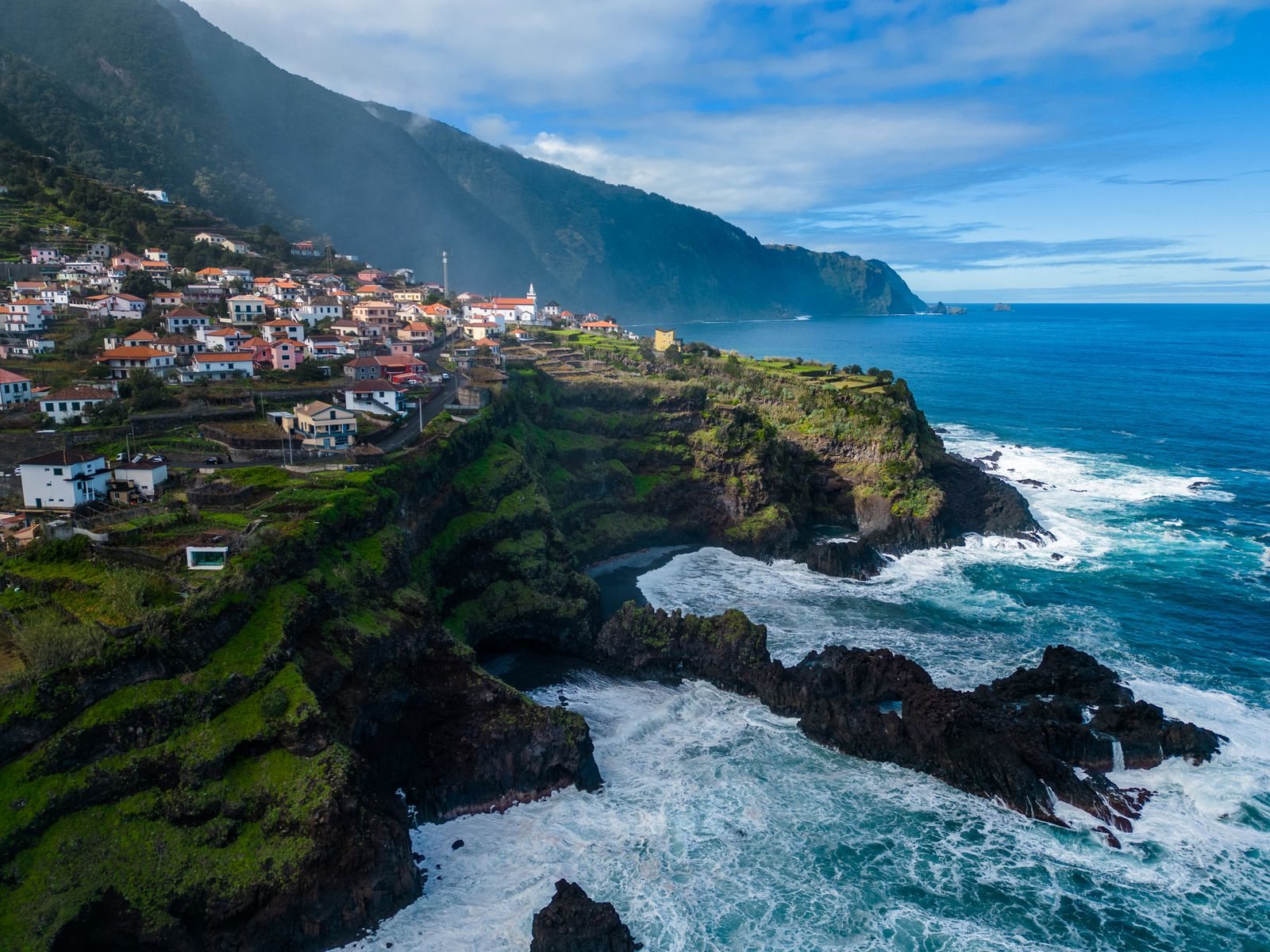 Seixal village on green cliffs above the Atlantic in Madeira
